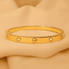 Golden Screw-Detail Crystal Bangle